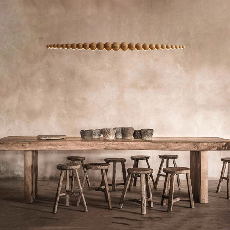 Front view of the elegant wooden LED pendant light in a modern kitchen setting.
