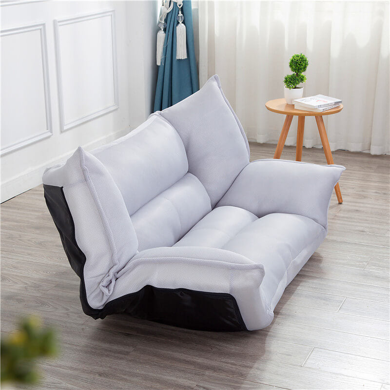 Angle view of the versatile modern sofa bed folded into a couch, ideal for small apartments.