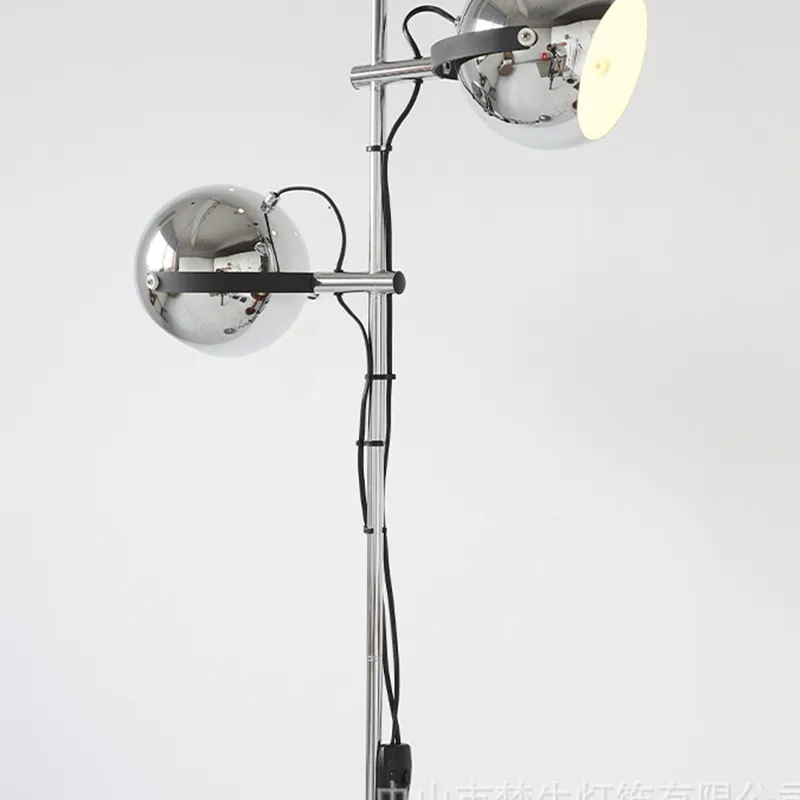 Side view of the Modern Chrome Bauhaus LED Floor Lamp in a cozy living room setting.