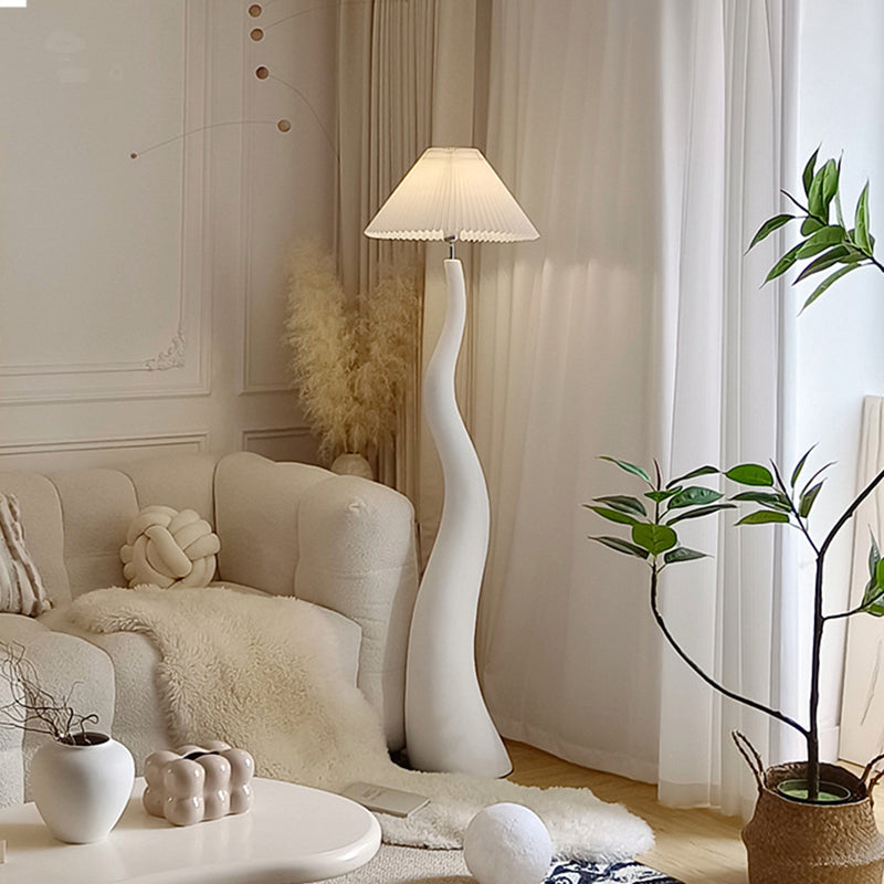 Elegant Curved Mushroom Resin Floor Lamp with warm light in a cozy living room setting.