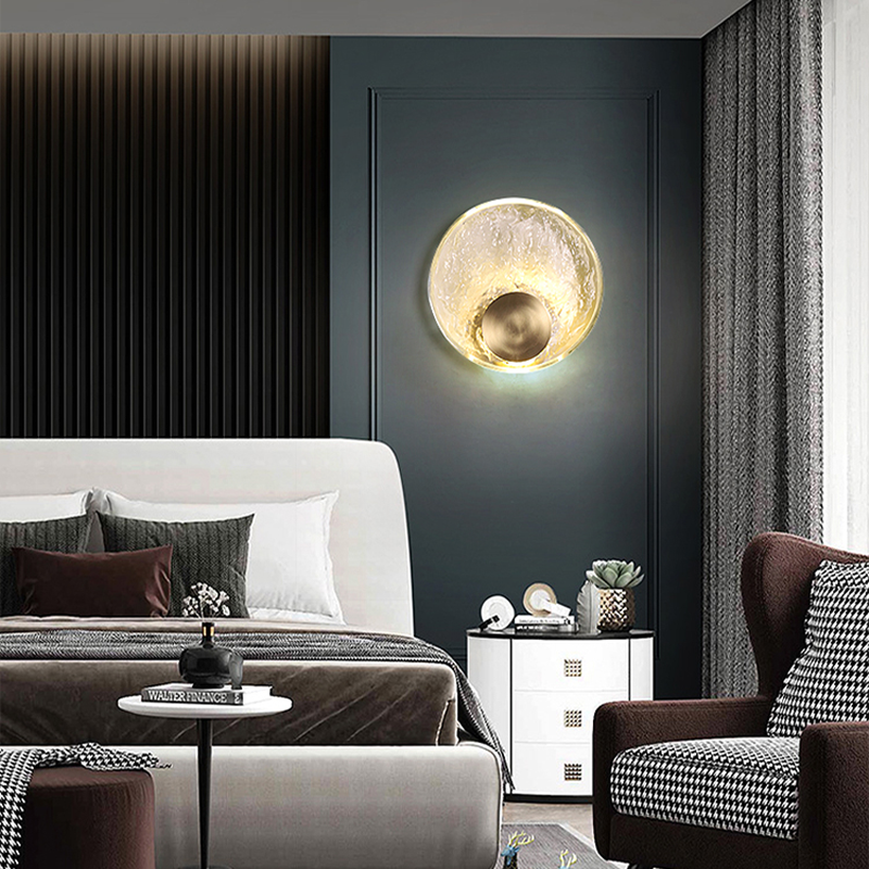 Side view of the elegant water wave glass wall sconce showcasing its crystal material and gold accents.