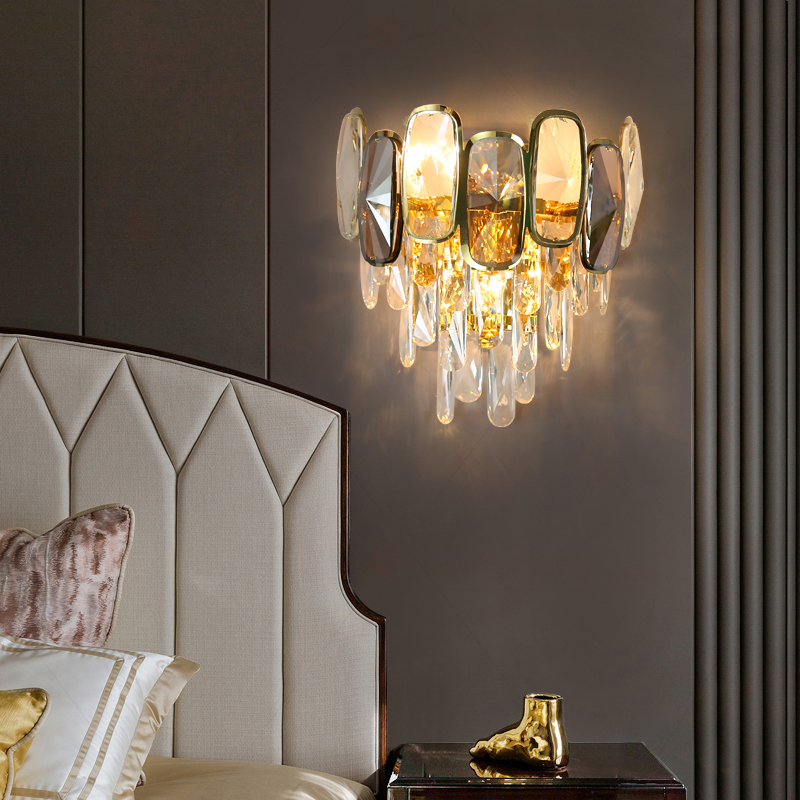 Close-up of the Aurora Luxe LED wall sconce showing precision-cut crystal wall light