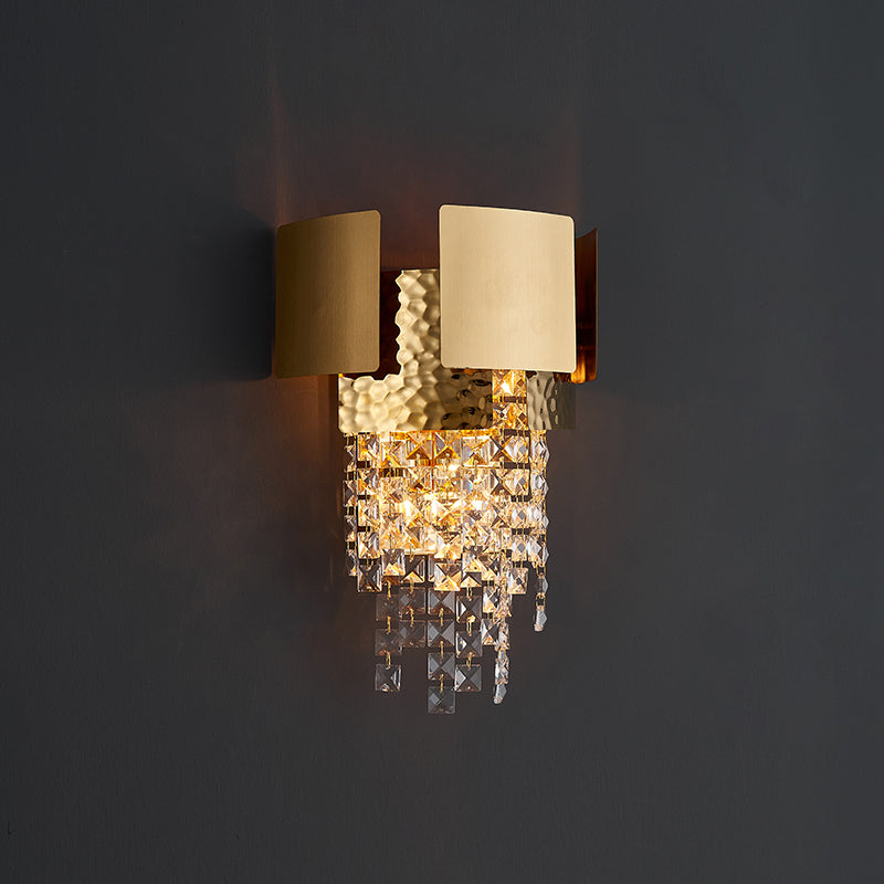 Close-up of the elegant gold crystal raindrop wall sconce showcasing its unique design.