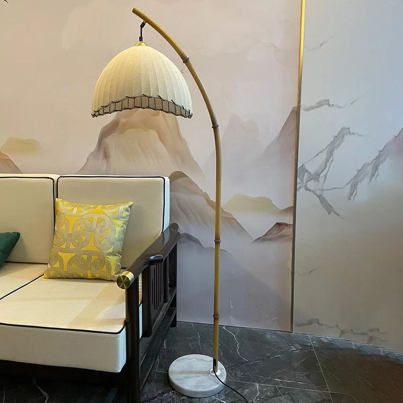 Elegant beige dome bamboo lamp in a modern living room setting.