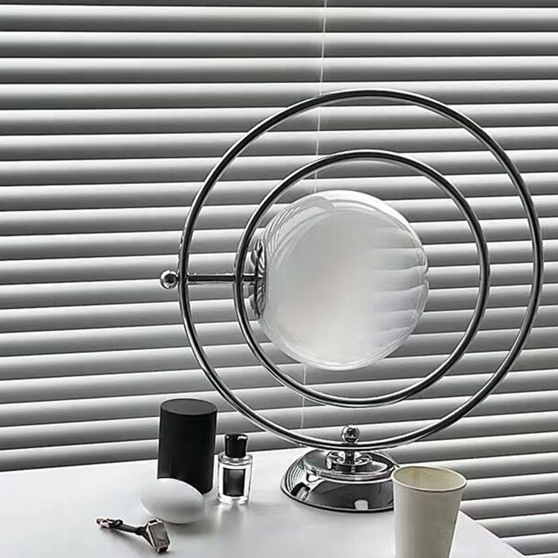 LunaGlow Rotating Glass Moon Table Lamp showcasing its elegant design with ambient light.