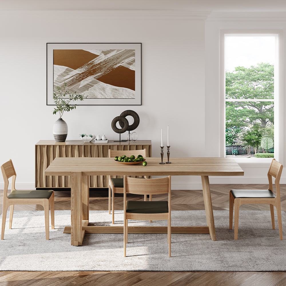 View of the elegant ash wood farmhouse dining table showcasing geometric legs and wood grain texture.