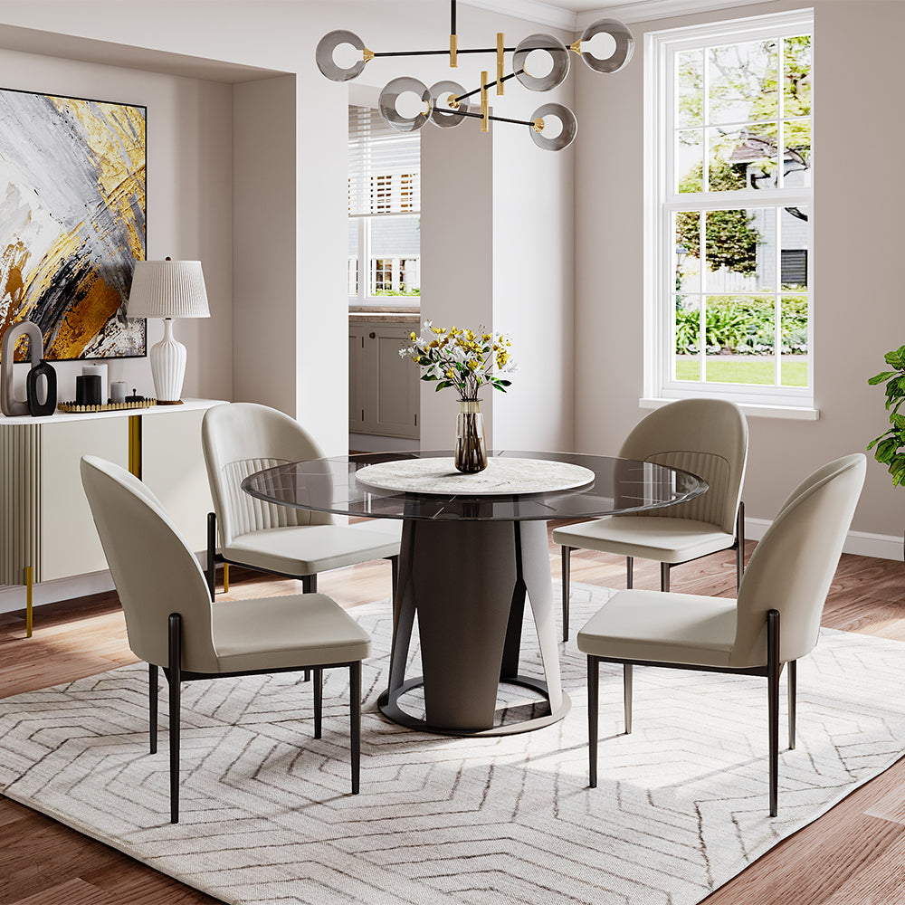 Overhead view of round pedestal table set for six, showing sintered stone centerpiece