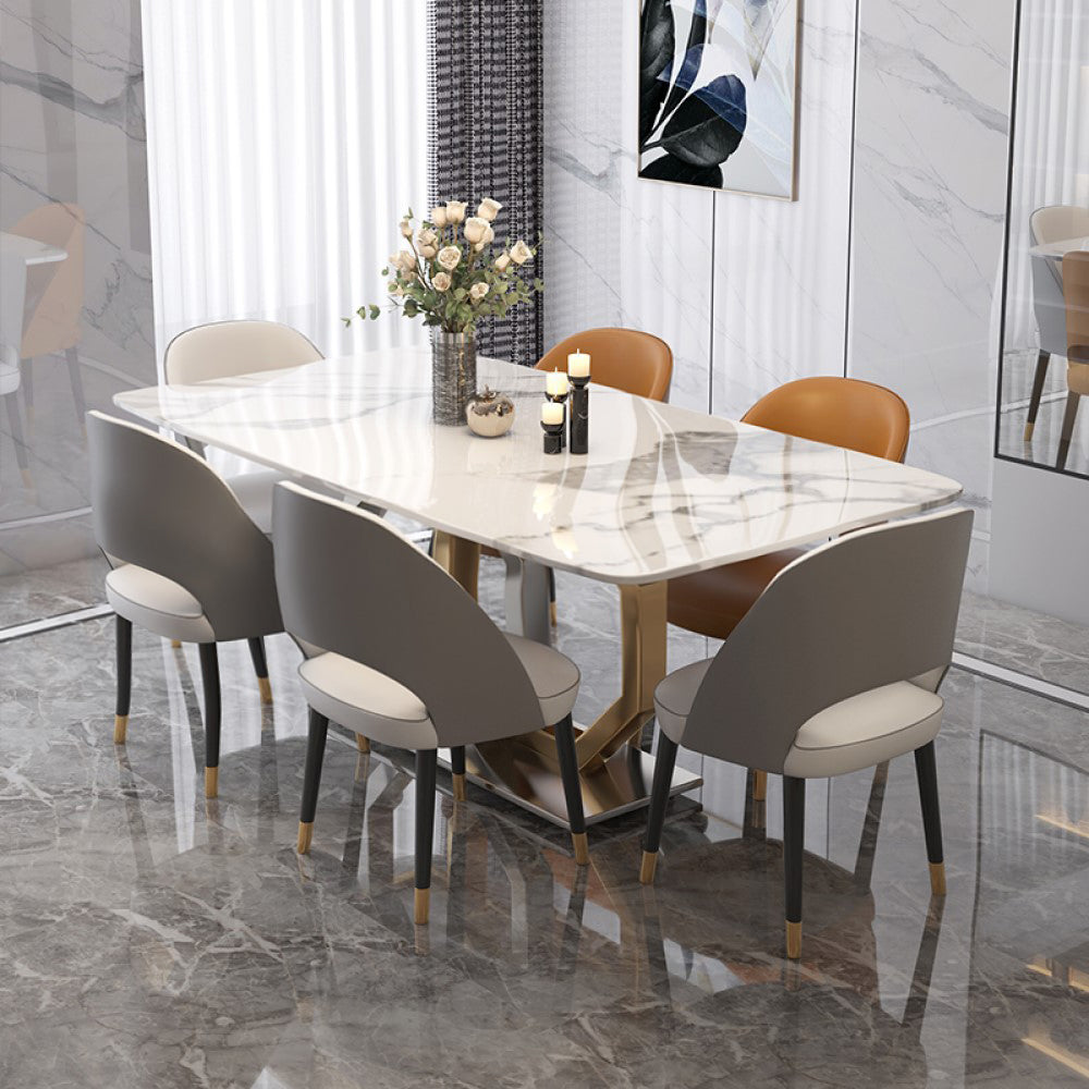 Elegant white marble dining table with steel legs, perfect for modern homes.