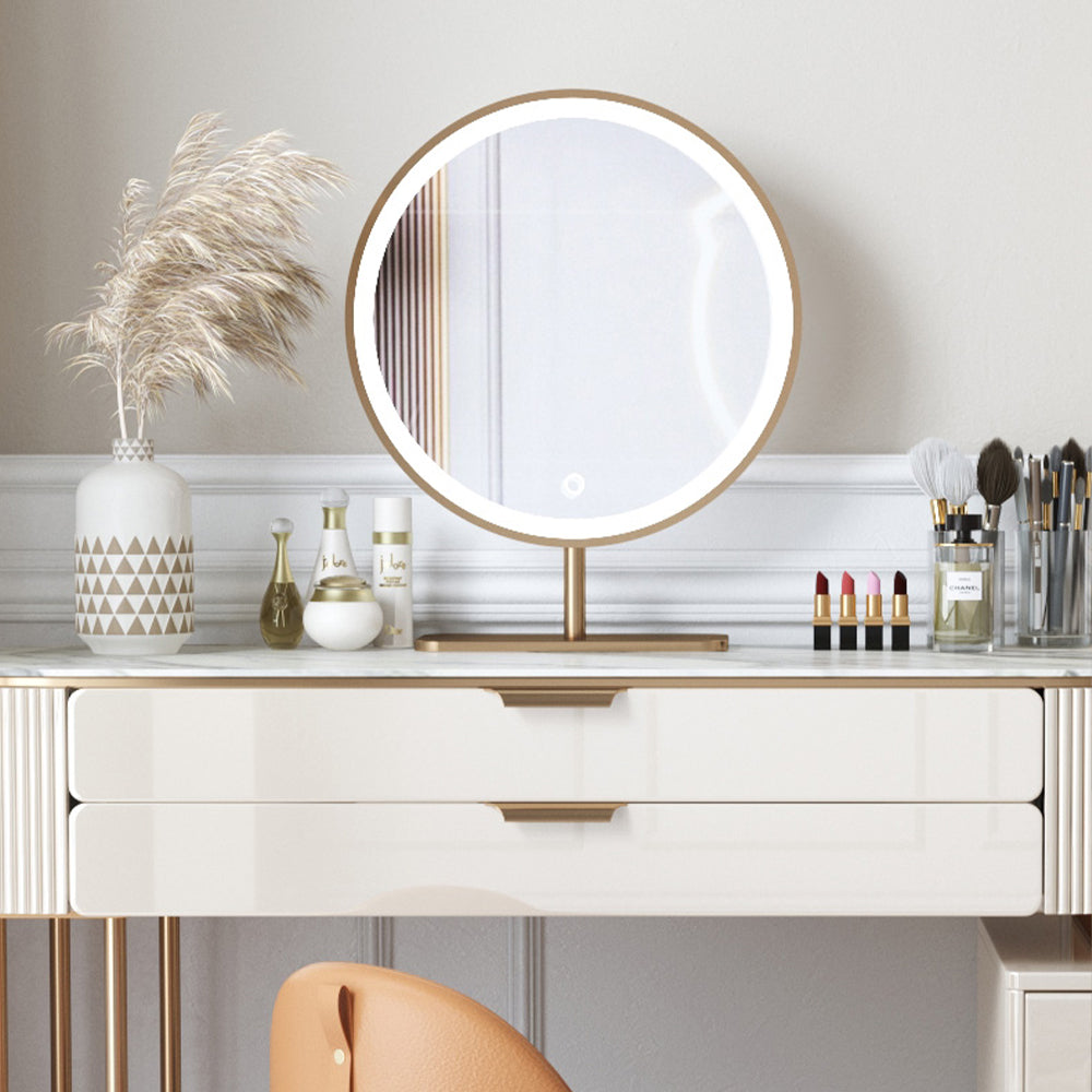Elegant beige L-shaped makeup vanity set displayed in a cozy beauty room, highlighting its spacious drawers and mirror.