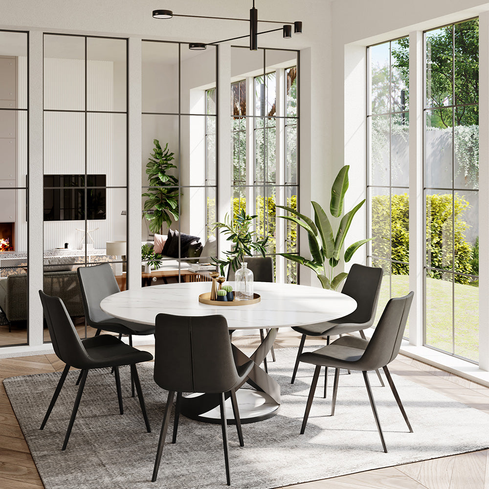 Elegant round marble dining table from an overhead view showcasing its sleek design and steel base.