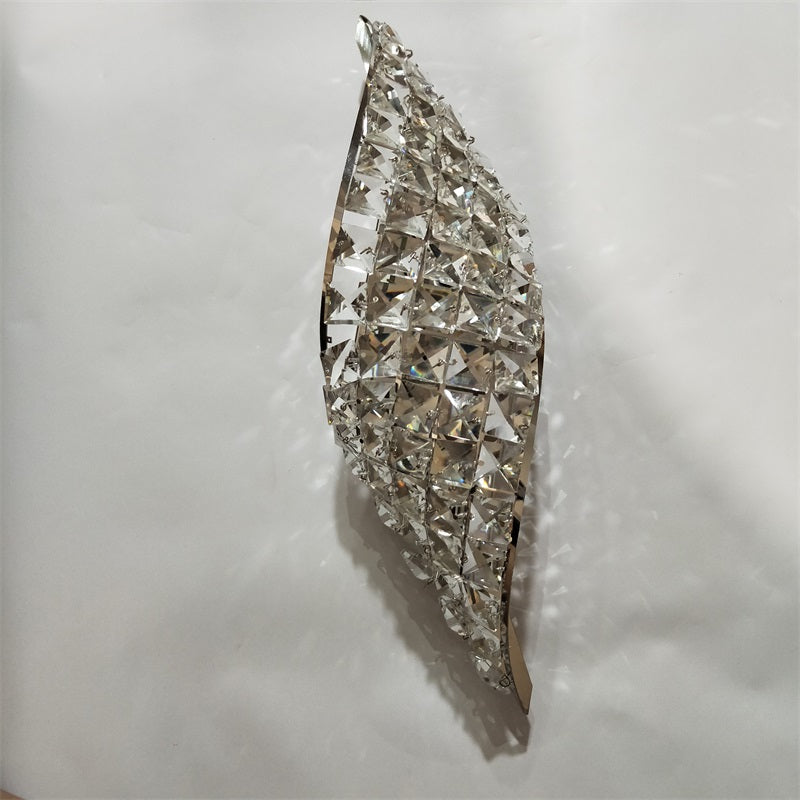 Elegant chrome LED wall sconce showcasing crystal details from a side angle.