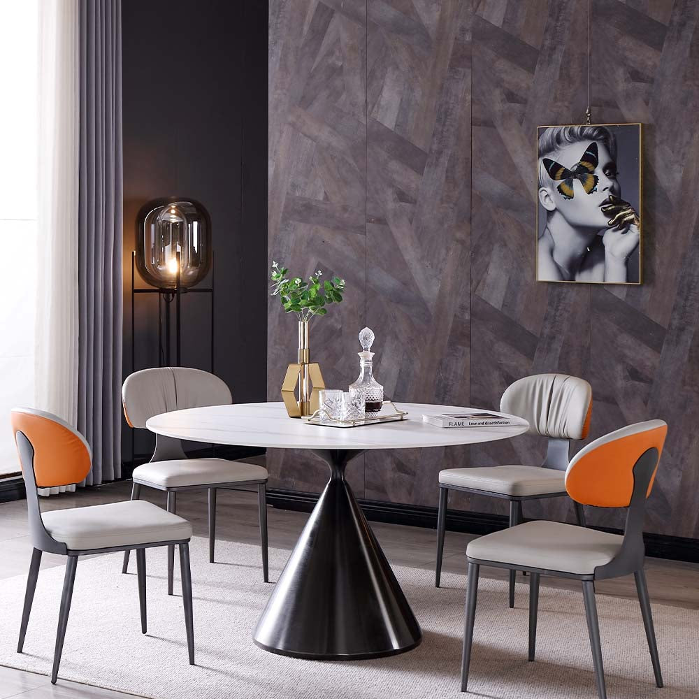 Elegant white tulip dining table showcasing round design and stainless steel base from a side angle.