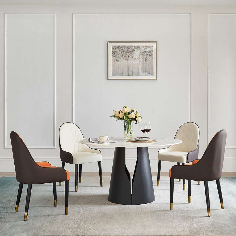 Elegant round sintered stone dining table set in a bright dining room.