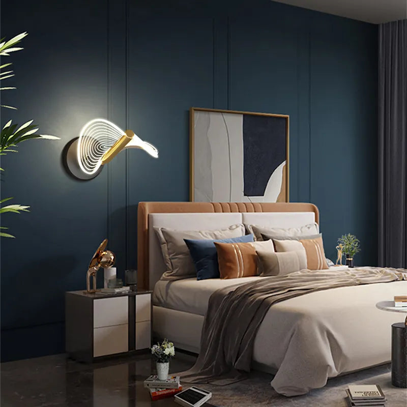 Close-up view of the contemporary gold wavy glass LED wall sconce showcasing its sleek design.