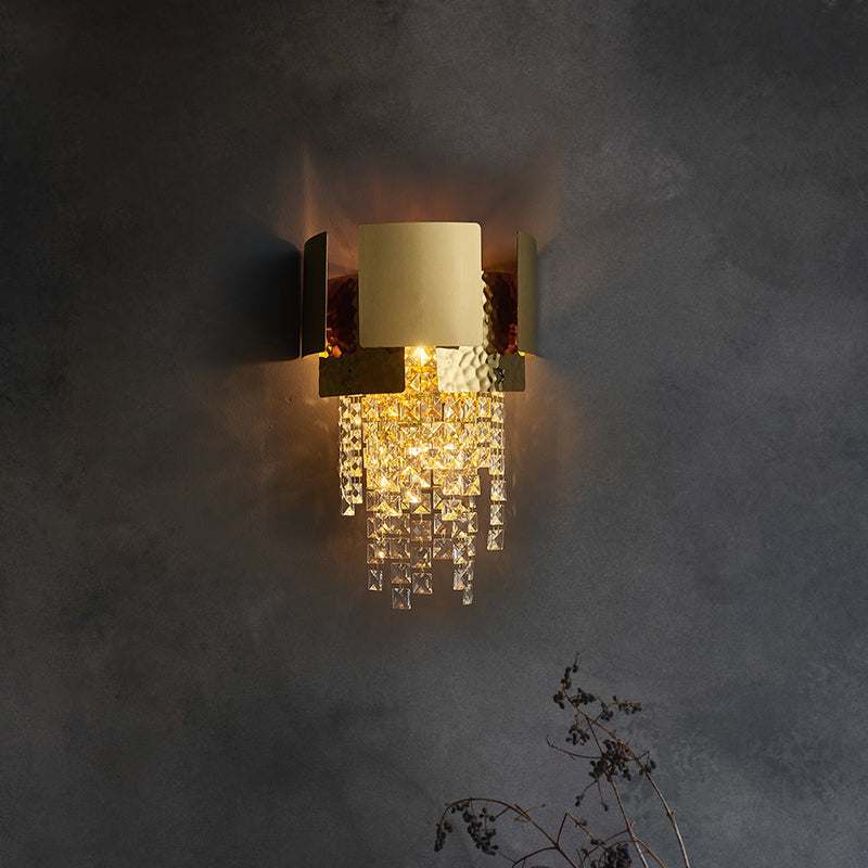 Close-up of the elegant gold crystal raindrop wall sconce showcasing its unique design.