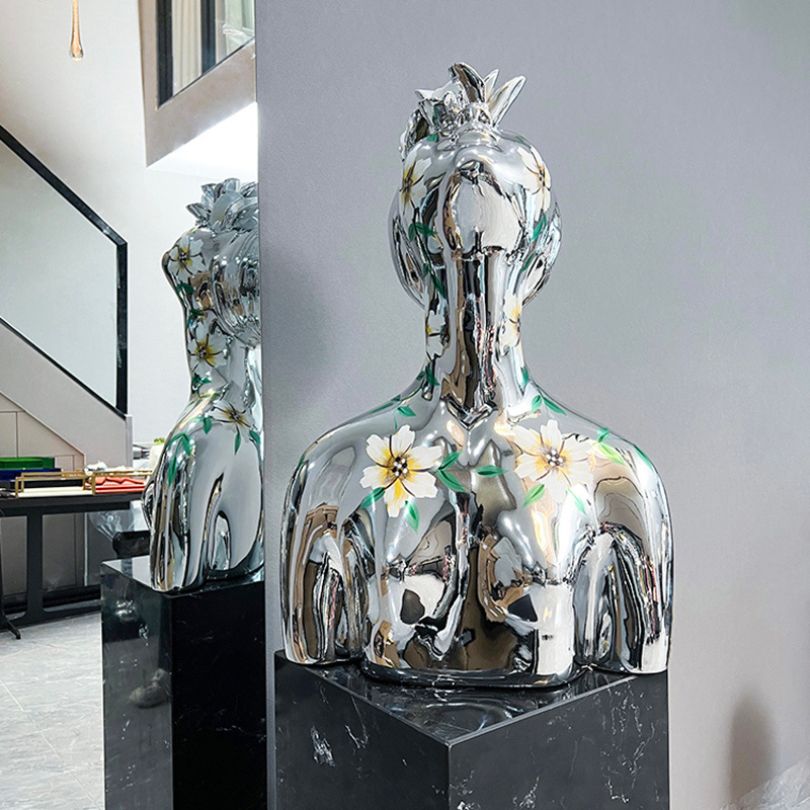Electroplated Goddess Sculpture showcasing hand-painted floral details from a side angle.
