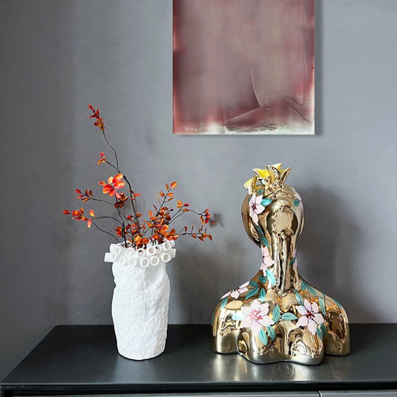 Electroplated Goddess Sculpture showcasing hand-painted floral details from a side angle.