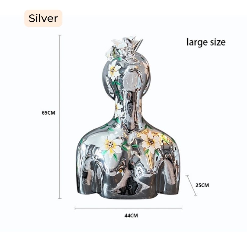 Electroplated Goddess Sculpture showcasing hand-painted floral details from a side angle.
