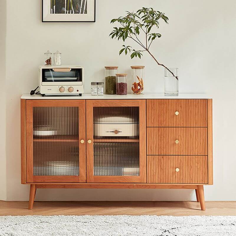 Elegant cherry wood sideboard showcasing glass doors and adjustable shelves in a beautifully styled living room.