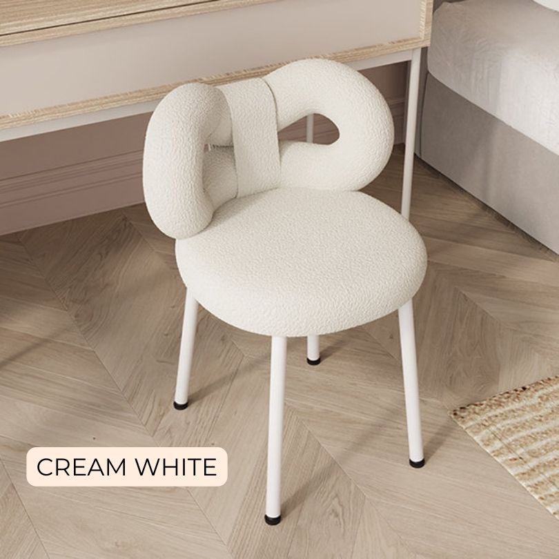 Pale Pink Chic Modern Vanity Bow Stool placed in a bright, stylish bedroom setting.