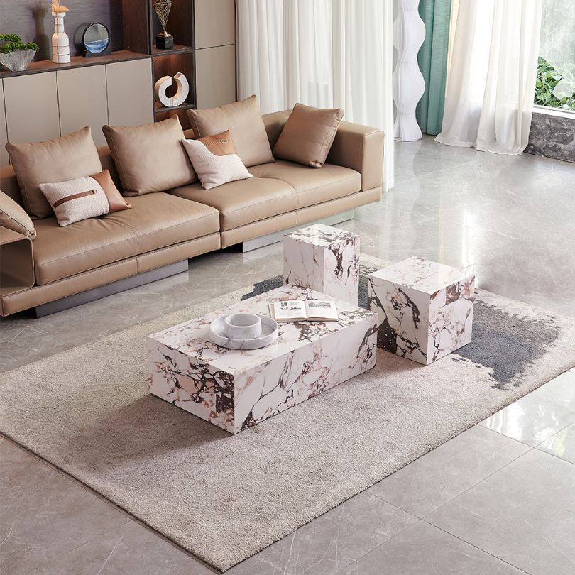 Top-down view of the Lunara sintered stone coffee table styled with a vase and books