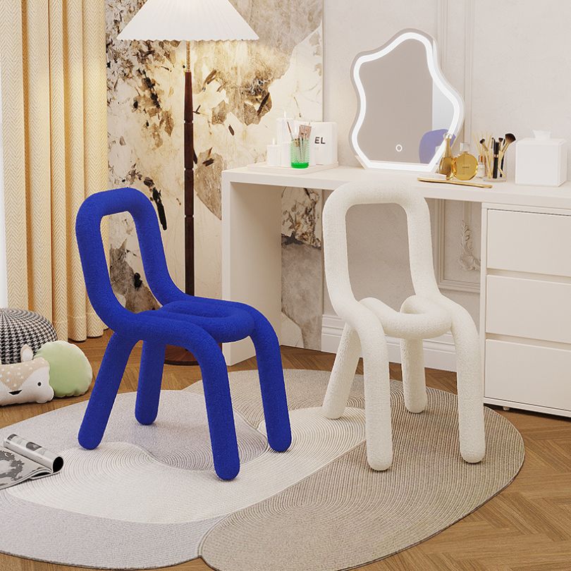Stylish contemporary upholstered bold chair in blue, perfect for a dressing area.