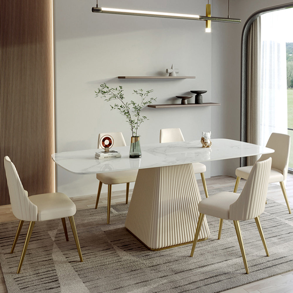 Elegant white rectangular marble dining table showcasing its smooth surface and stylish design.
