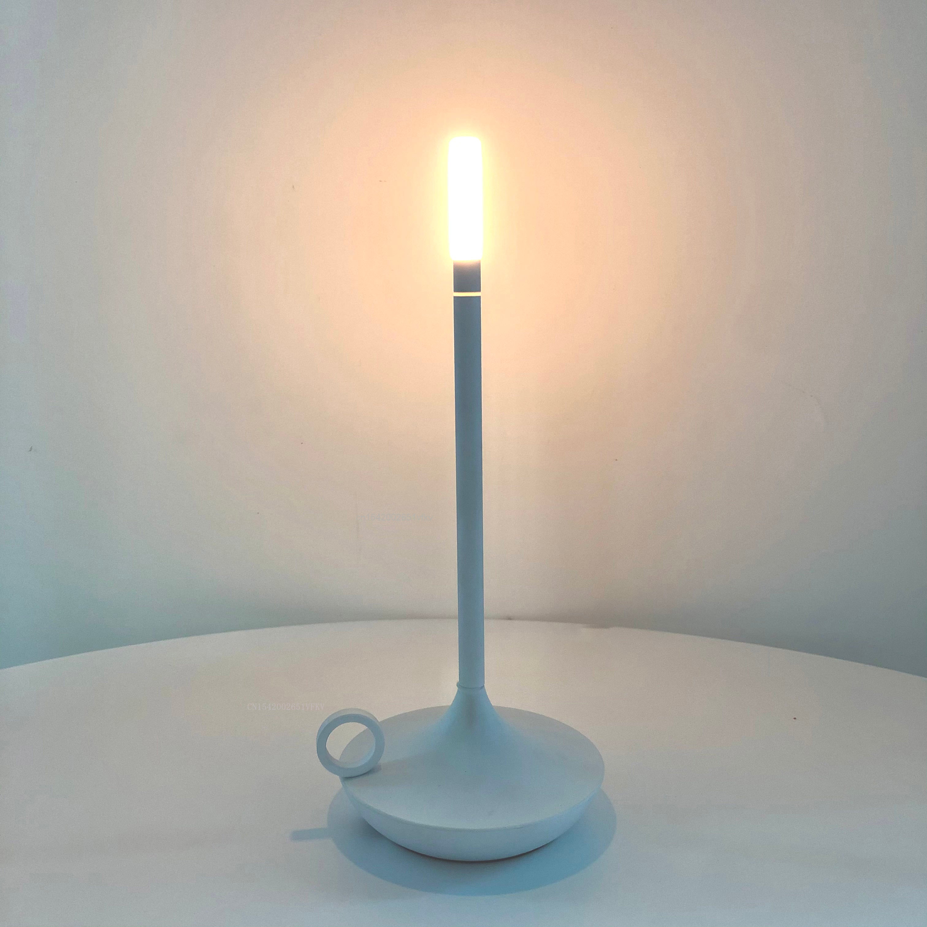 Modern USB rechargeable table light on a dining table, showcasing its warm glow.