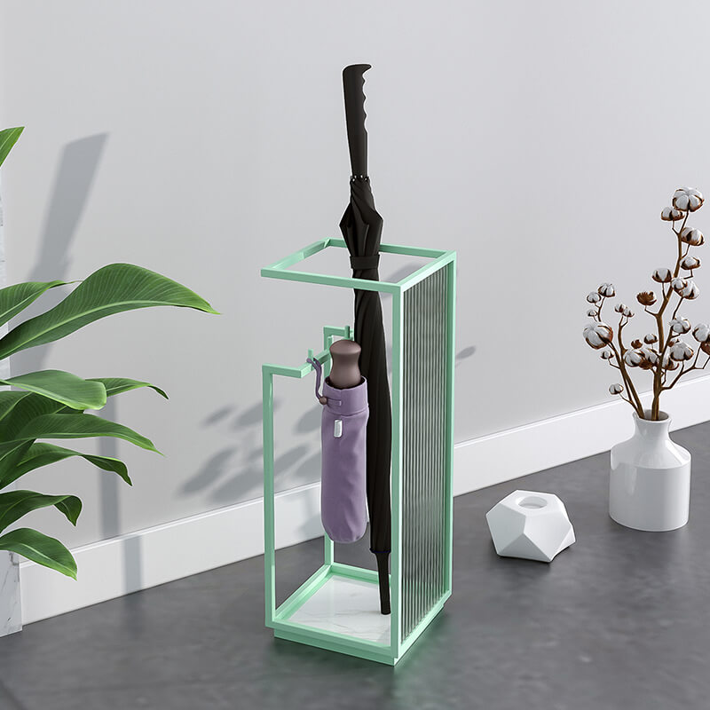 Sleek metal and glass umbrella holder showcasing its elegant design in a modern hallway.