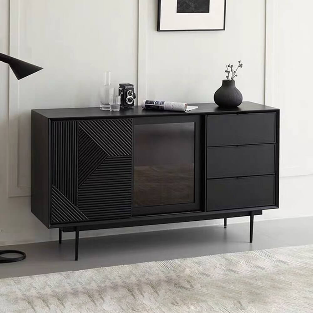 Angled front view of the black wood sideboard with drawers and shelves and geometric tempered glass doors