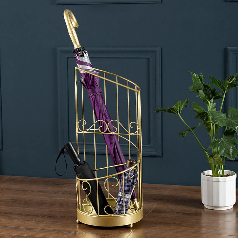 Front view of the elegant gold metal umbrella stand showcasing its intricate design.