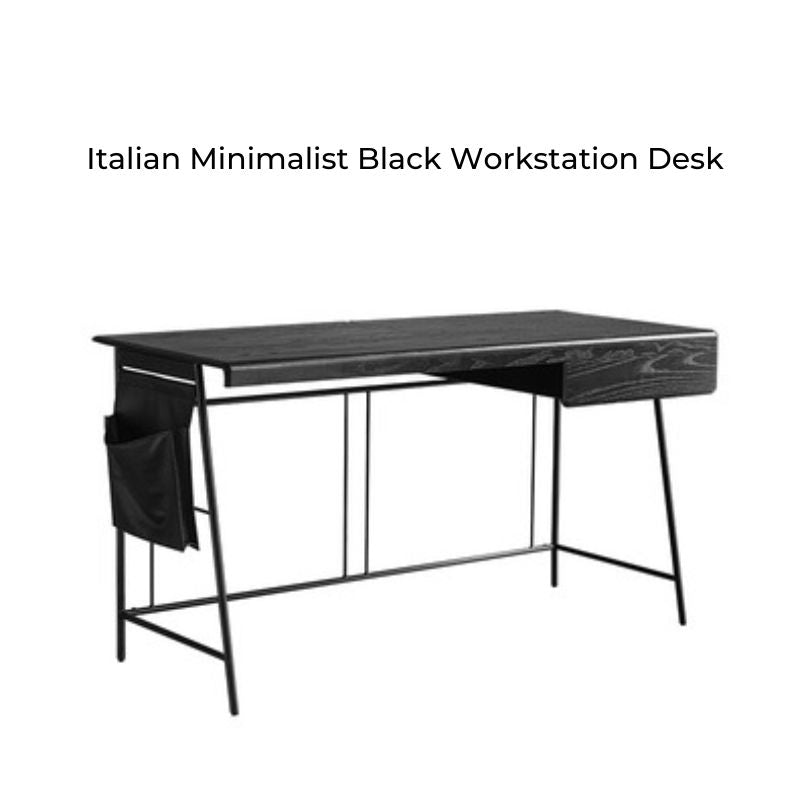 Top-down view of the black desk with a laptop, lamp, and decorative items arranged for an inspiring workspace.