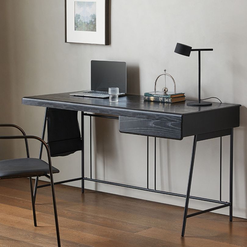 Side view of the Italian minimalist black workstation desk showcasing its sleek design and ample storage.