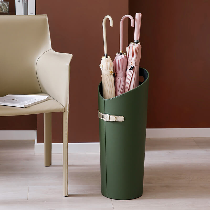 Elegant leather umbrella rack showcasing multiple umbrellas in a modern entryway.