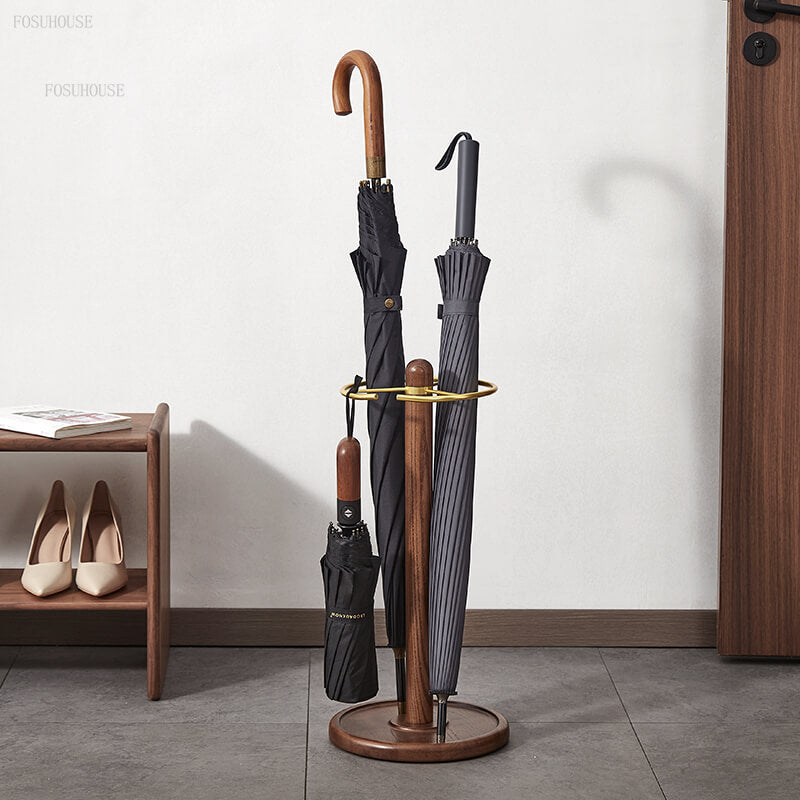 Elegant wooden umbrella holder in a modern hallway with umbrellas stored inside.