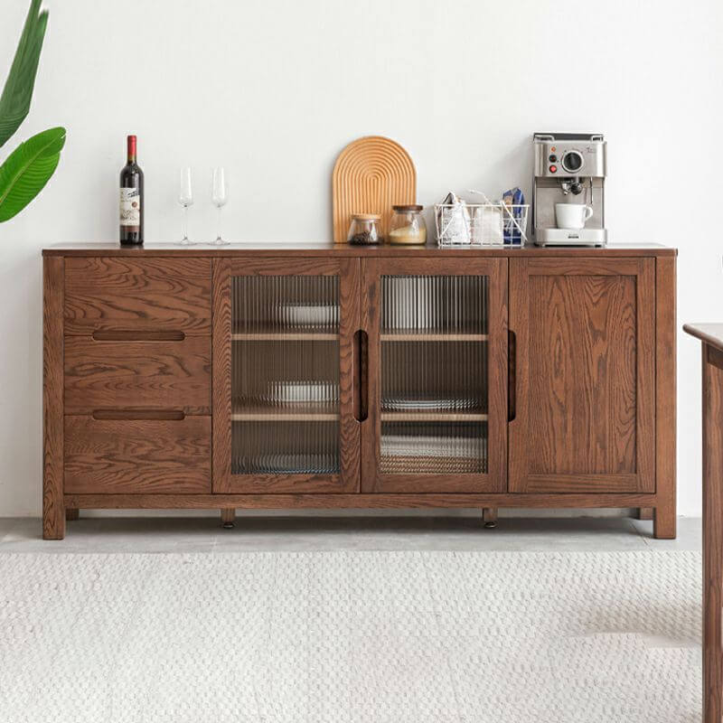 Front view of the mid-century modern wooden sideboard with glass doors, displaying decorative items.