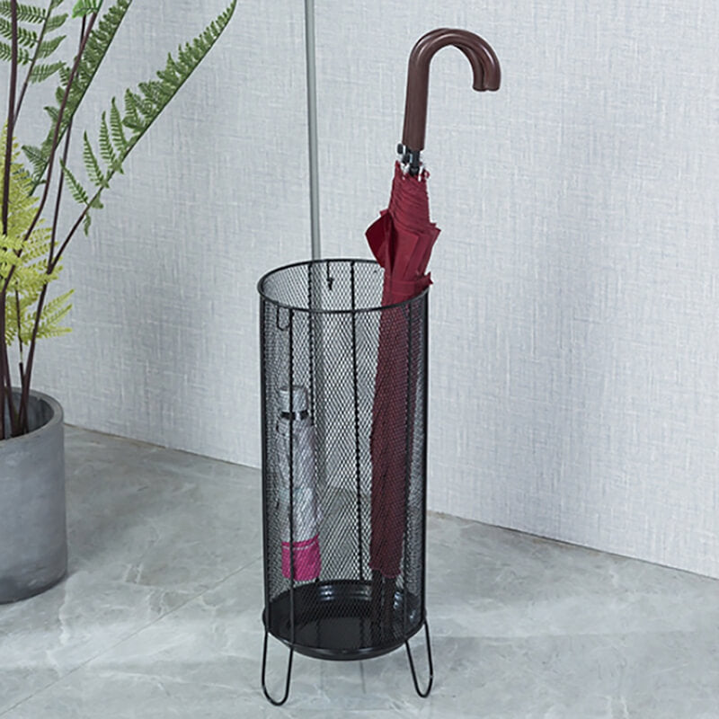 Sleek metal umbrella stand showcasing modern design in an entryway.