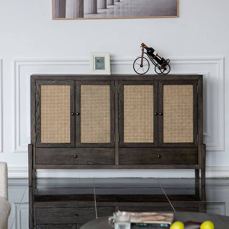 Mid-century oak sideboard with rattan doors in a dining room setting, showcasing its ample storage capacity.