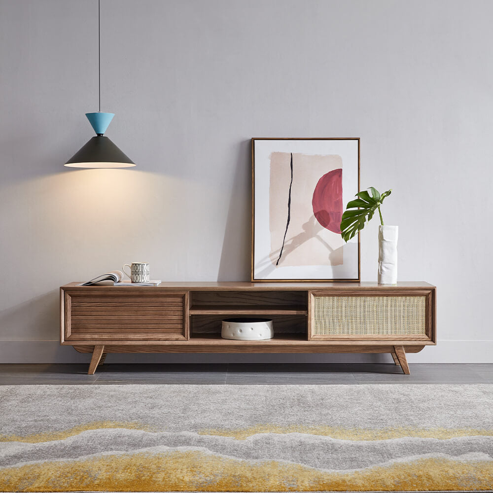 Mid century modern sliding TV stand showcasing its elegant design and rattan doors.