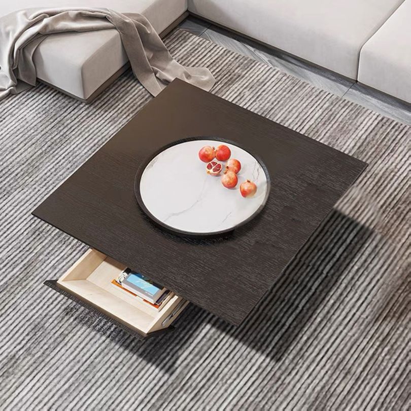 Close-up of the minimalist black coffee table showcasing the round Lazy Susan feature.