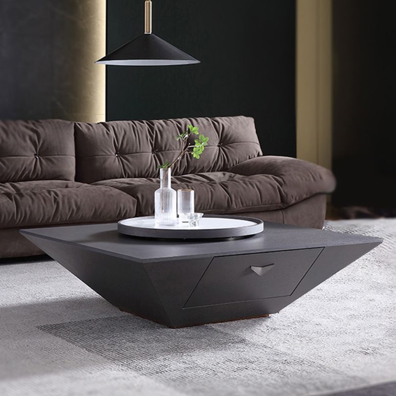 Contemporary black coffee table with Lazy Susan in a cozy living room setting.