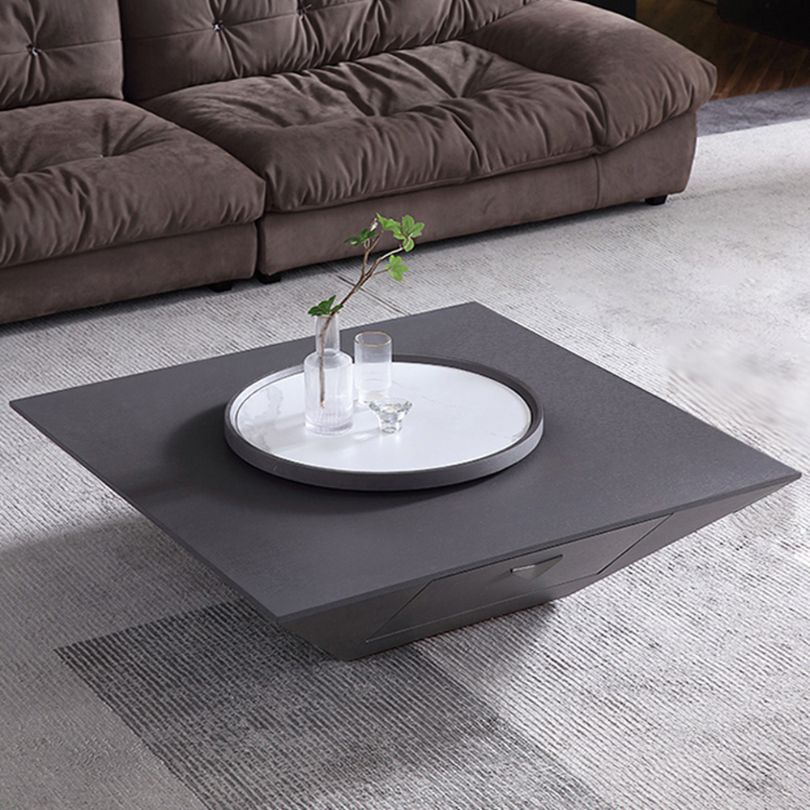 Contemporary black coffee table with Lazy Susan in a cozy living room setting.