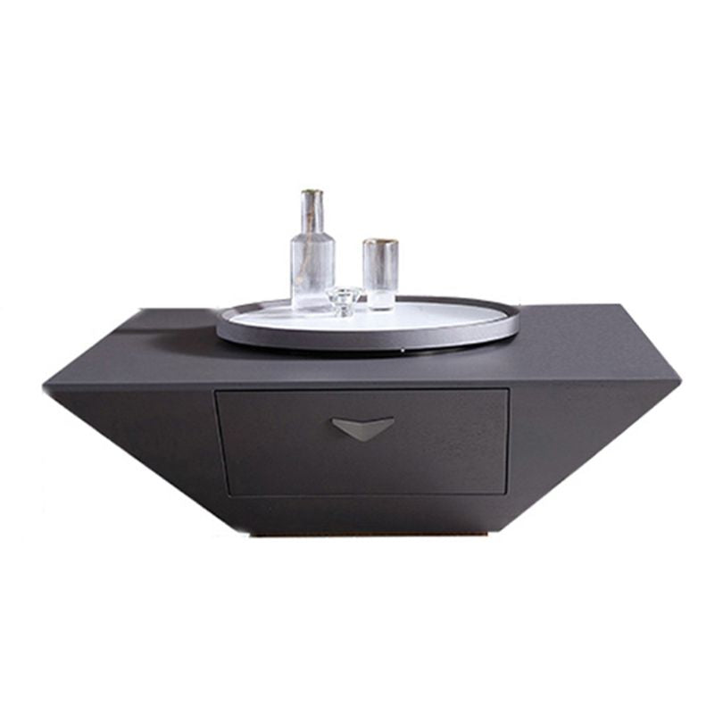 Contemporary black coffee table with Lazy Susan in a cozy living room setting.
