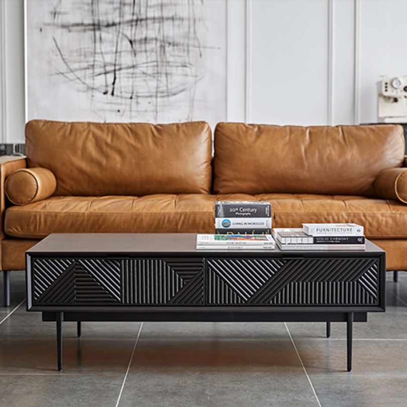 Functional coffee table in a modern living room setting, demonstrating its use and stylish features.