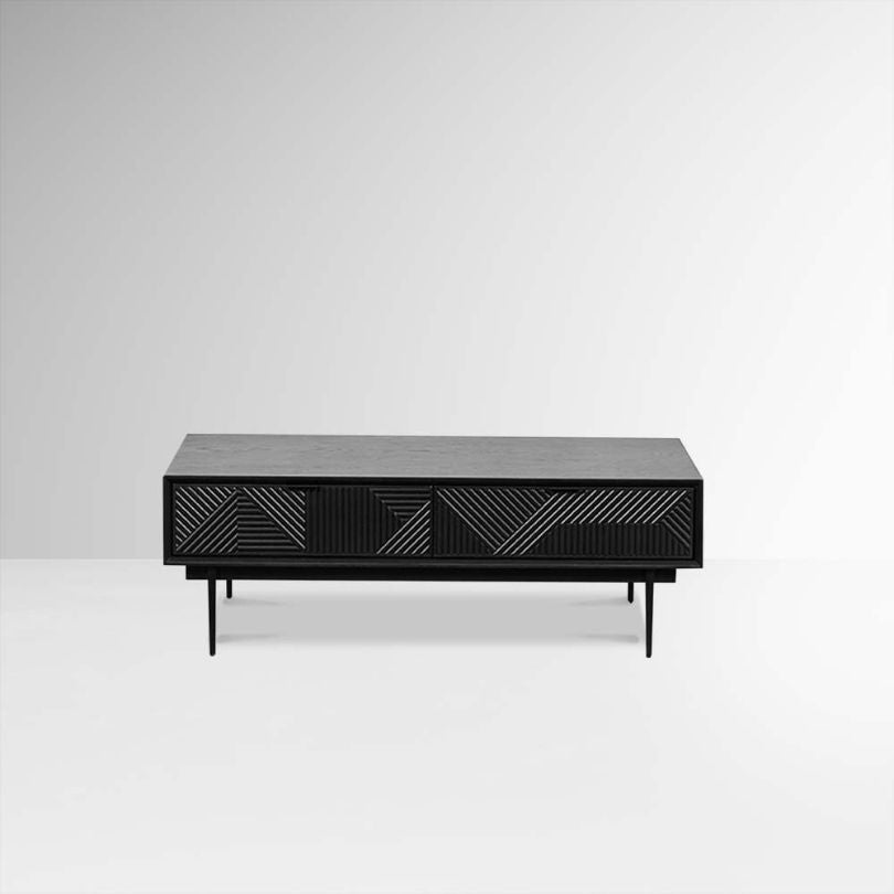 Functional coffee table in a modern living room setting, demonstrating its use and stylish features.