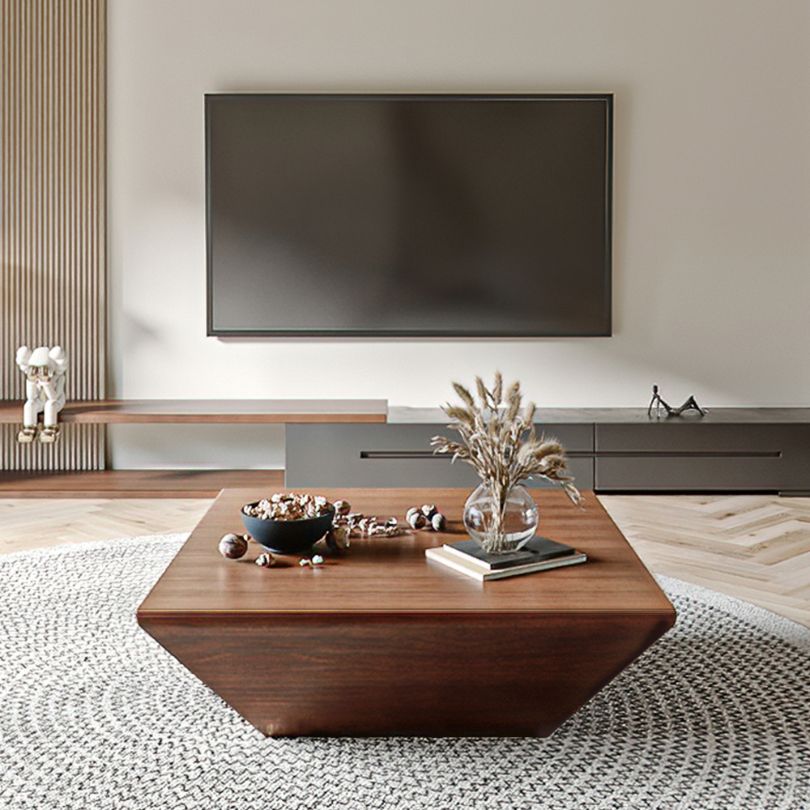 Side view of the modern geometric walnut coffee table showcasing its trapezoidal design and smooth finish.