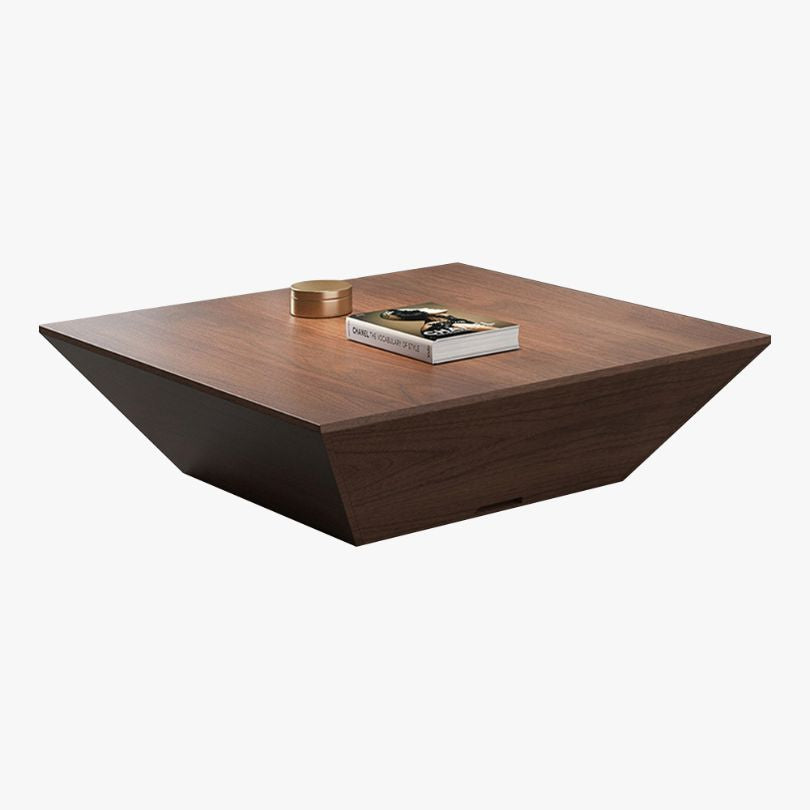 The minimalist walnut coffee table in a cozy living room setting, highlighting its functionality and storage drawer.