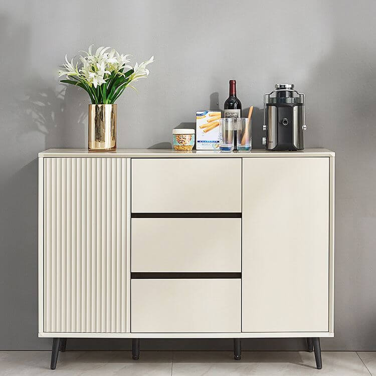Elegant minimalist white fluted sideboard in a modern living room setting, highlighting its sleek design and functionality.