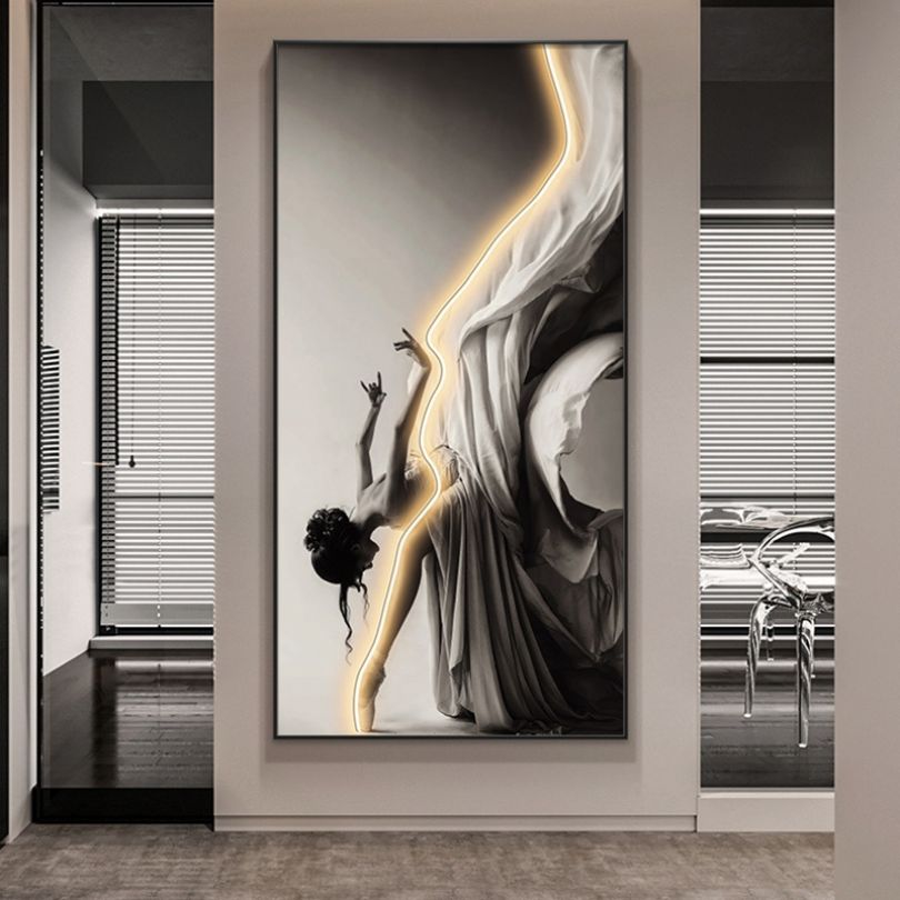 Illuminated ballet dancer wall art highlighting LED features in a living room.