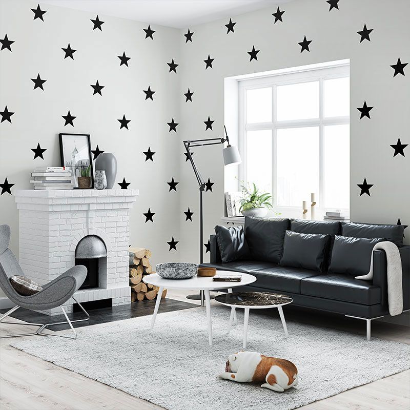 Geometric black and white star wallpaper showcasing its modern design in a stylish living room.